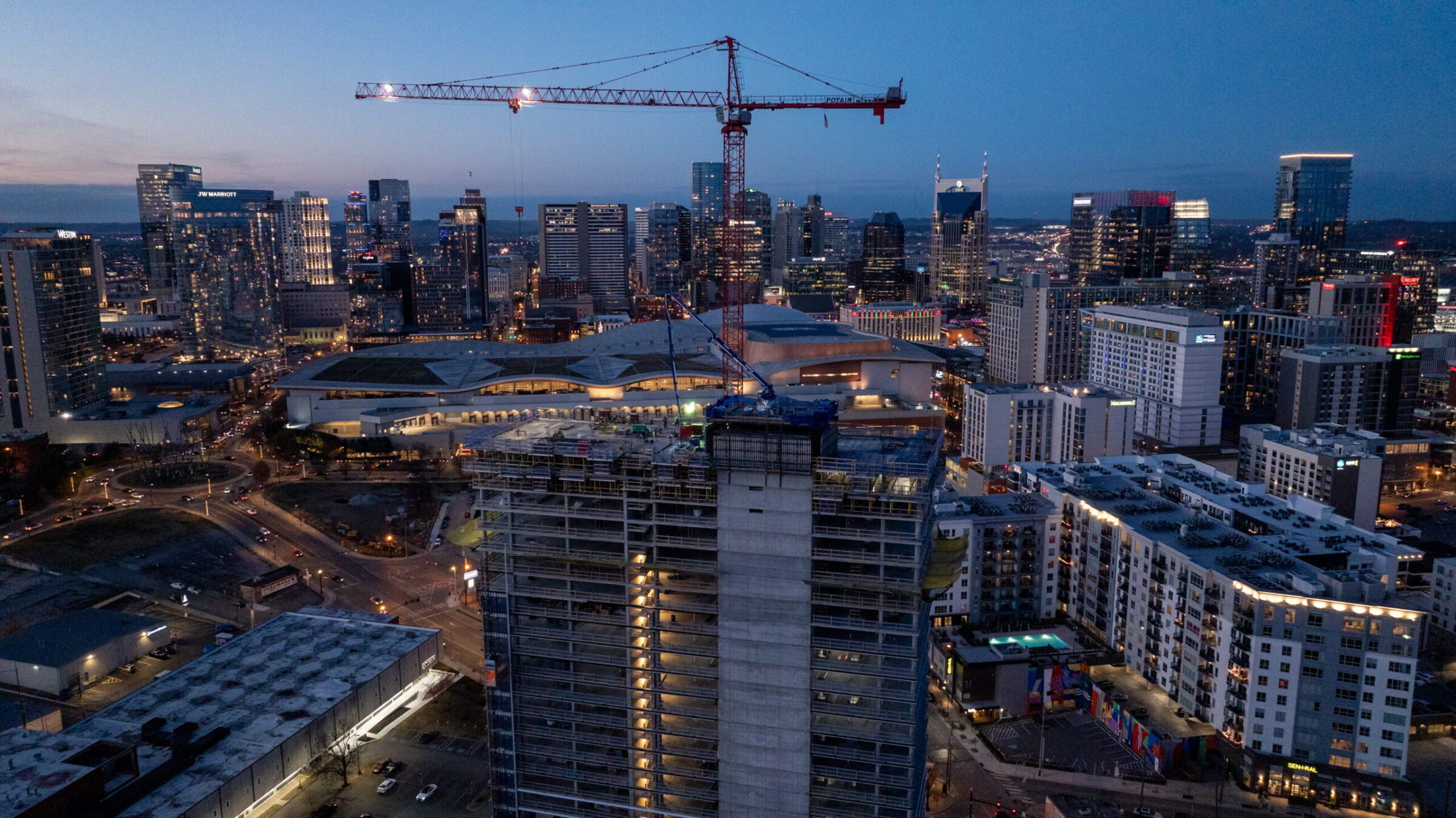 the ray concrete contruction project crane at dusk